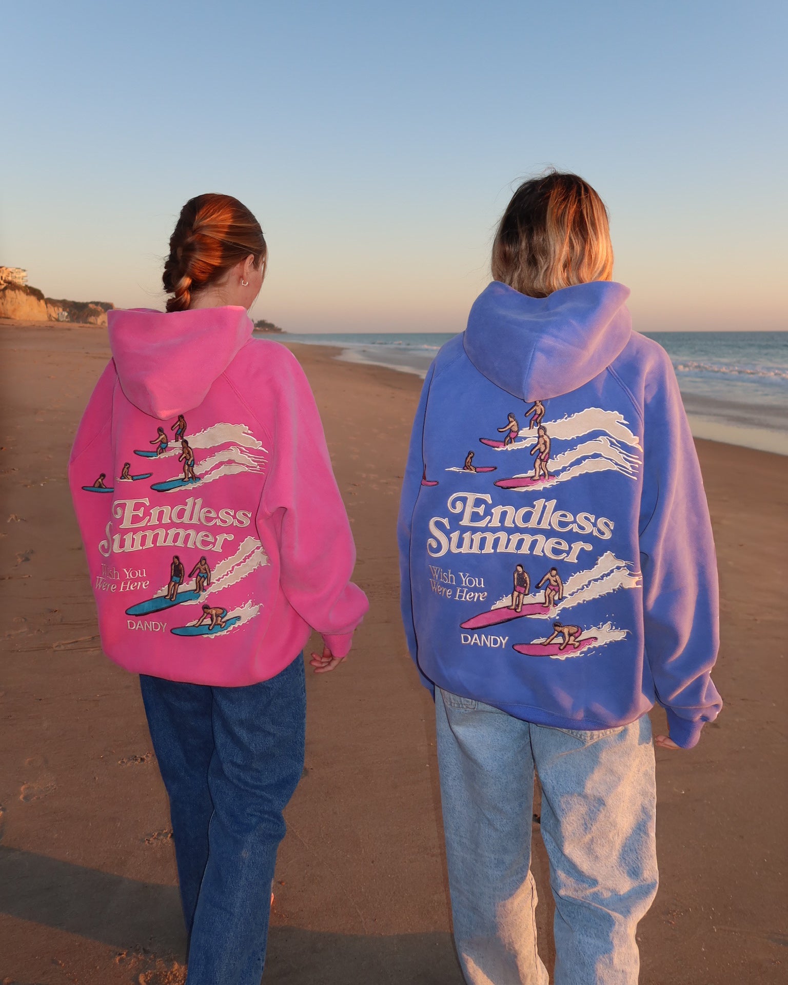 "Endless Summer" Oversized Lux Hoodie in Vintage Washed Pink walking next to the blue version of this hoodie