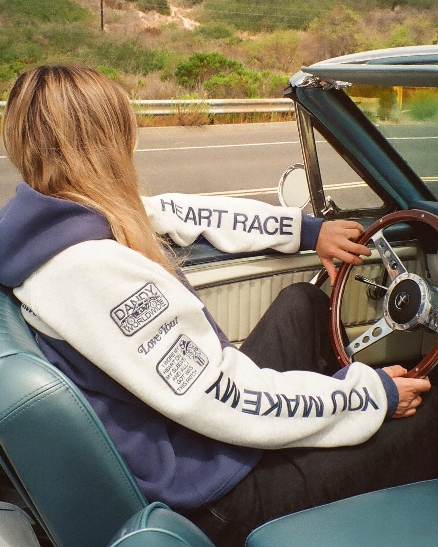 "Racing Heart" Oversized Lux Hoodie in Blue driving a vintage car