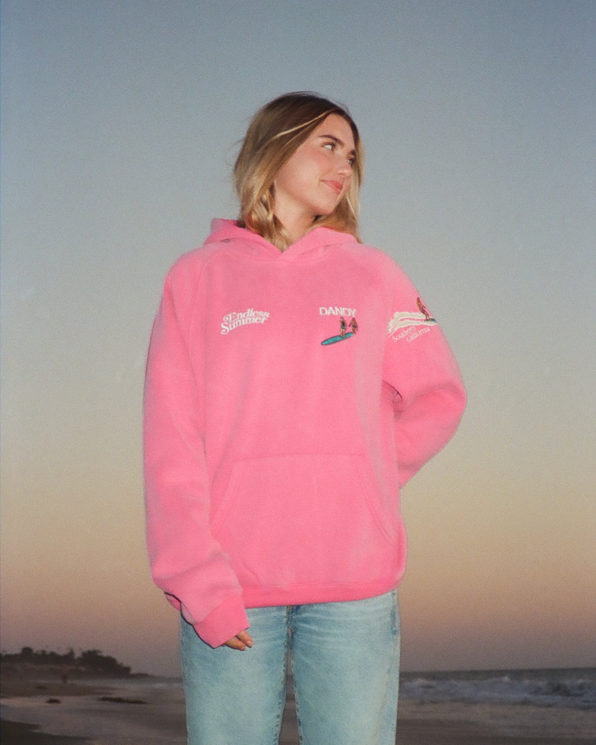 "Endless Summer" Oversized Lux Hoodie in Vintage Washed Pink showing the sunset on a beach at sunset