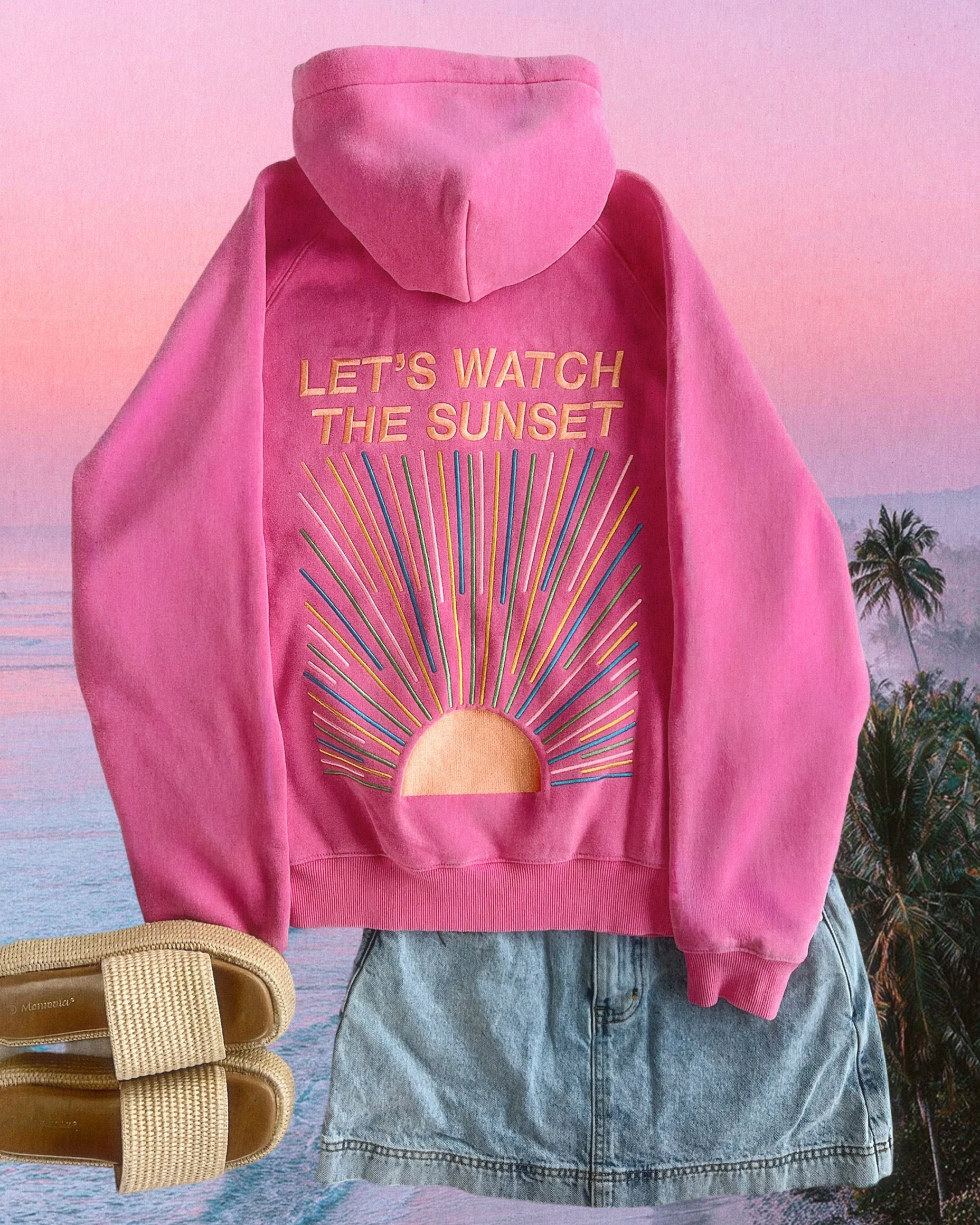 Pink hoodie with 'Let's Watch the Sunset' design on a beach background